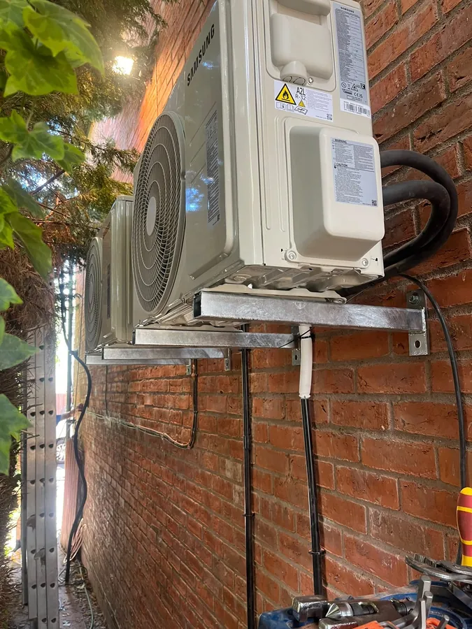 Multi-split air conditioning outdoor units mounted on wall brackets
