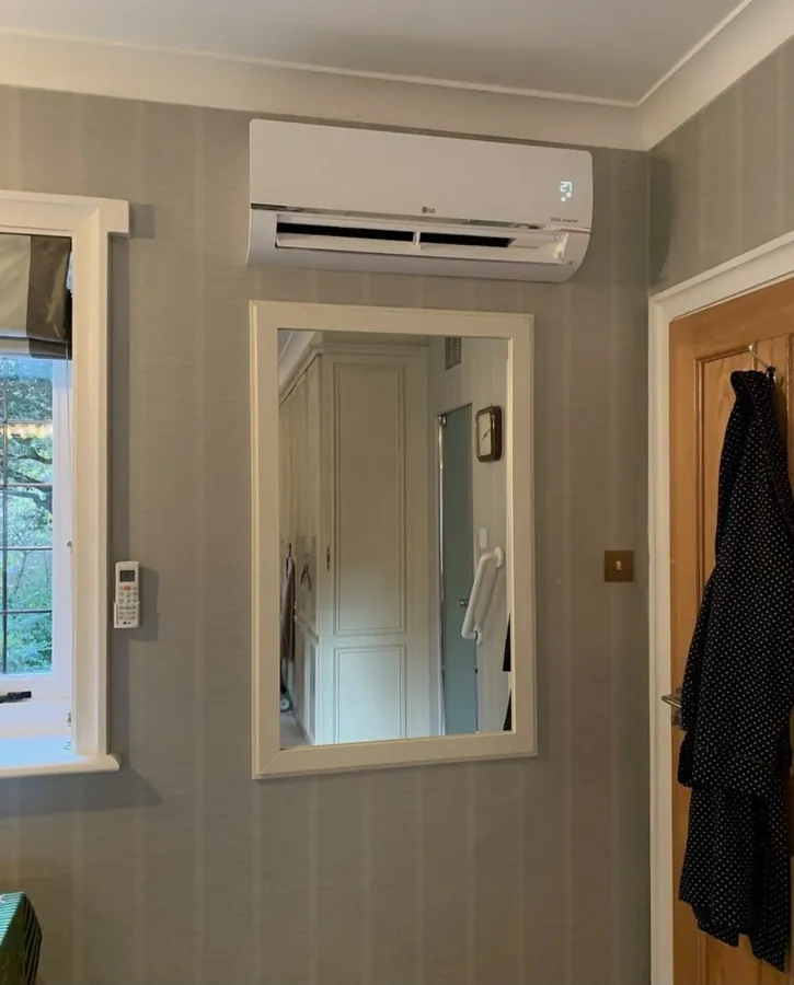 LG split system air conditioner installed in a bedroom