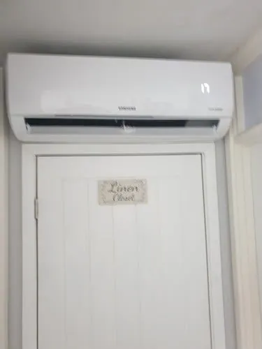 Samsung split system air conditioner installed above a doorway