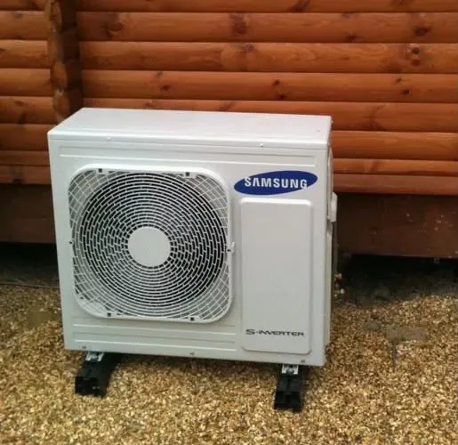 Samsung outdoor air conditioning unit beside a timber garden building